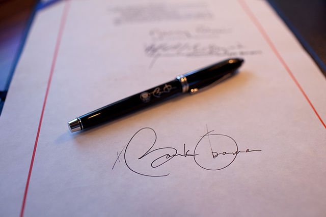 Pres. Obama's signature on a bill.
