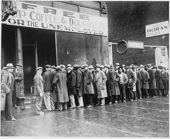 Unemployed men queued outside a depression soup kitchen opened in Chicago by Al Capone, 1931